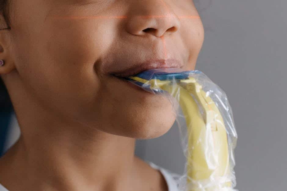 Image of a child at a dental checkup with the dentist examining their teeth