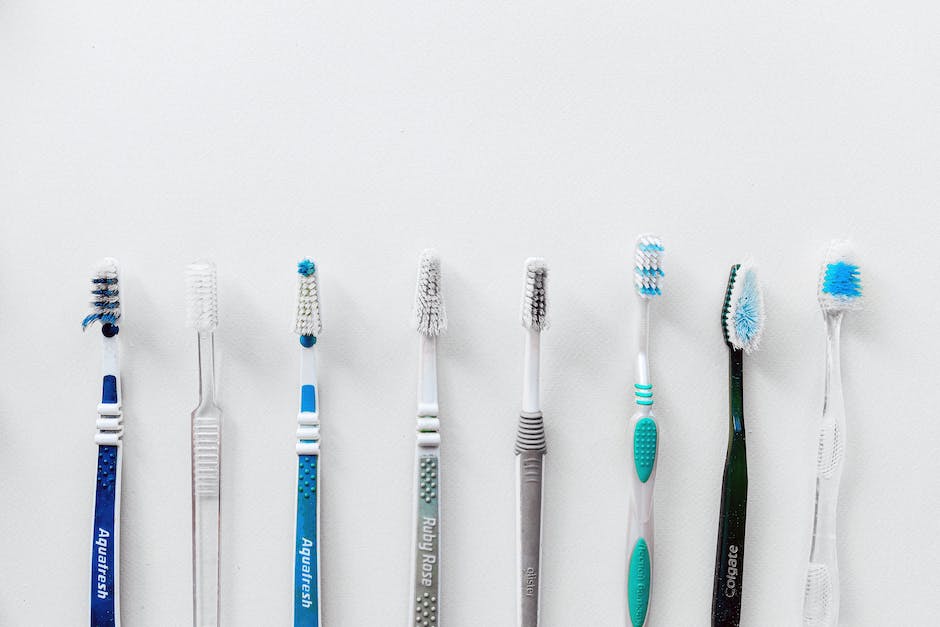 A family brushing their teeth together, showing the importance of dental hygiene for kids.