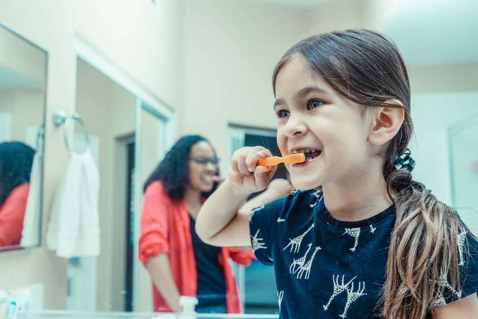 Image of a child brushing their teeth with a smile, promoting a positive tooth brushing routine for kids